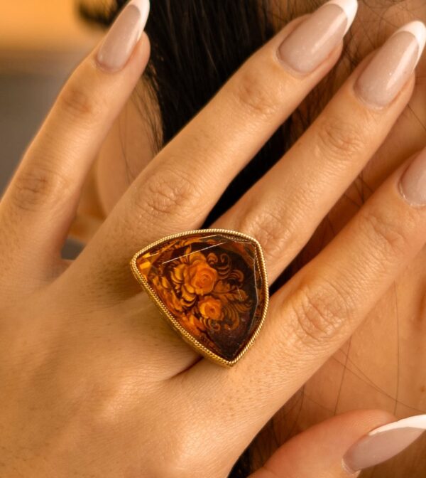 Amber ring with 18 karat gold